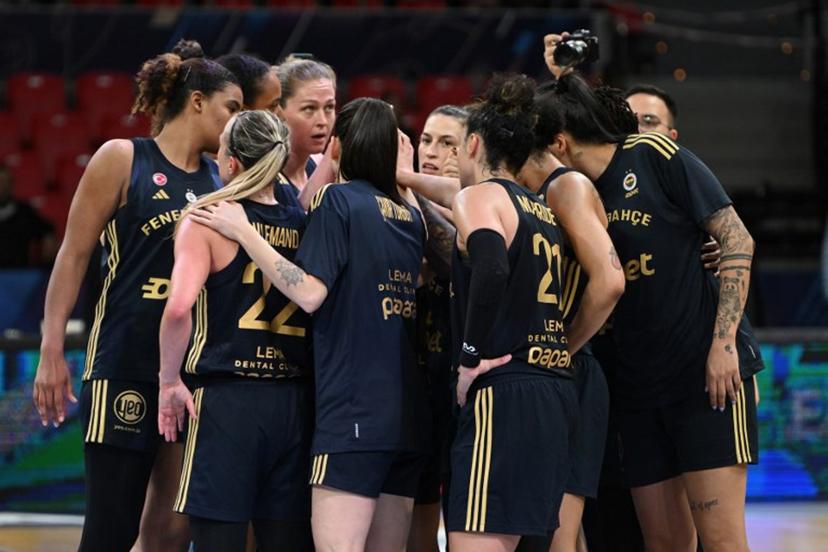 Fenerbahce players celebrate their third place after winning the Euroleague Women's final basketball match for third and fourth place between Valencia Basket Club and Fenerbahce at Pabellon Principe Felipe arena in Zaragoza on April 13, 2025. JAVIER SORIANO / AFP