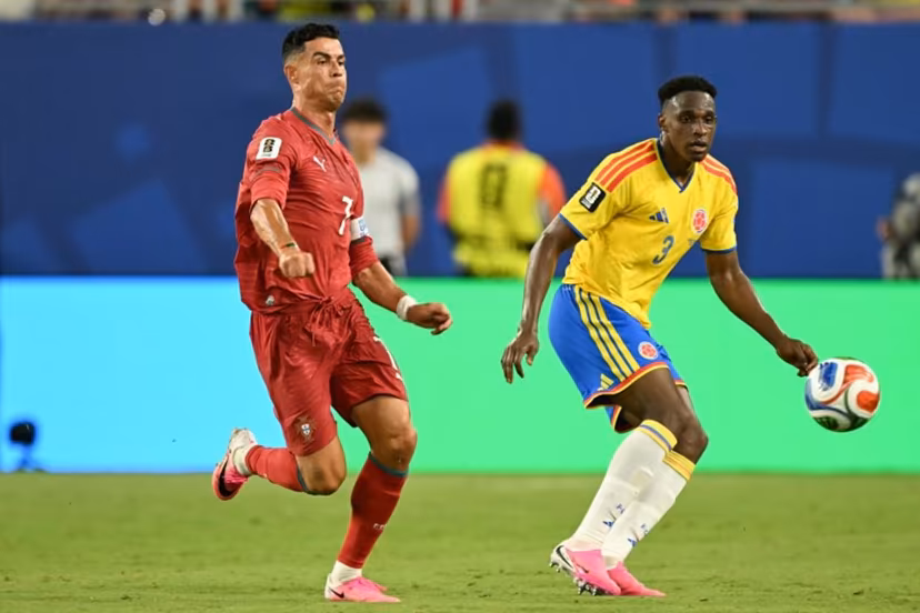Portugal's forward #07 Cristiano Ronaldo and Colombia's defender #03 Jhon Lucumi fight for the ball during the 2026 World Cup Group K football match between Colombia and Portugal at the Miami Stadium in Miami Gardens on June 27, 2026. CHANDAN KHANNA / AFP