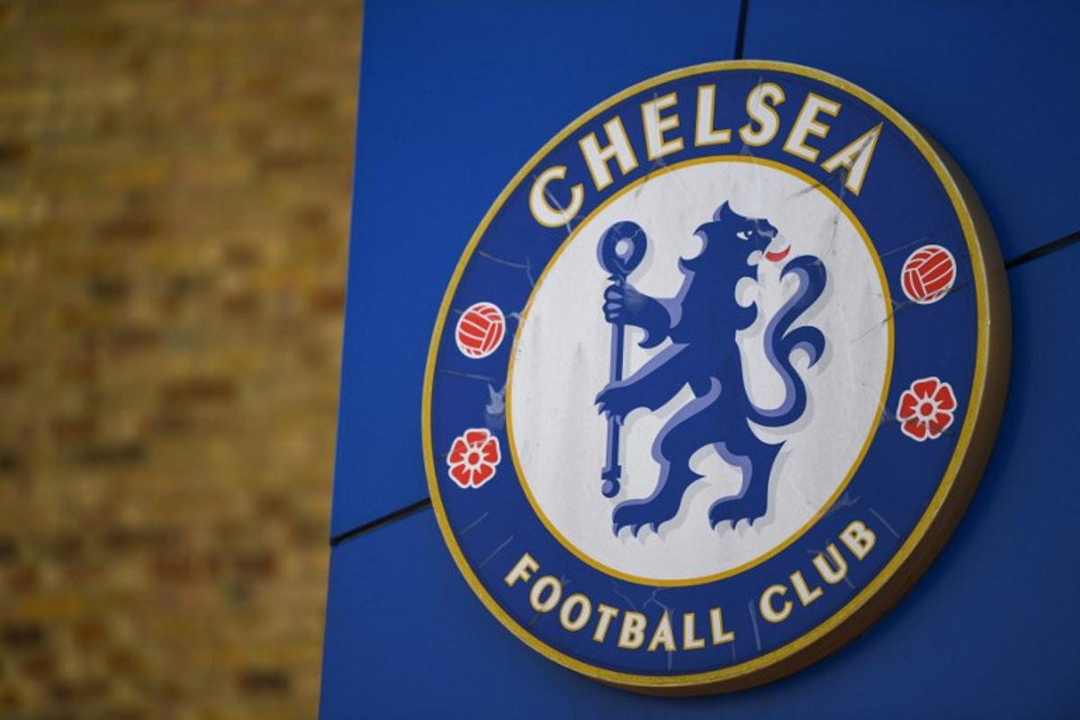 A picture shows the Chelsea FC emblem outside the club's home stadium Stamford Bridge in London on March 18, 2022. Chelsea manager Thomas Tuchel is hoping a quick sale of the European champions will provide clarity for employees and fans of the club with final bids to be submitted today. Daniel LEAL / AFP