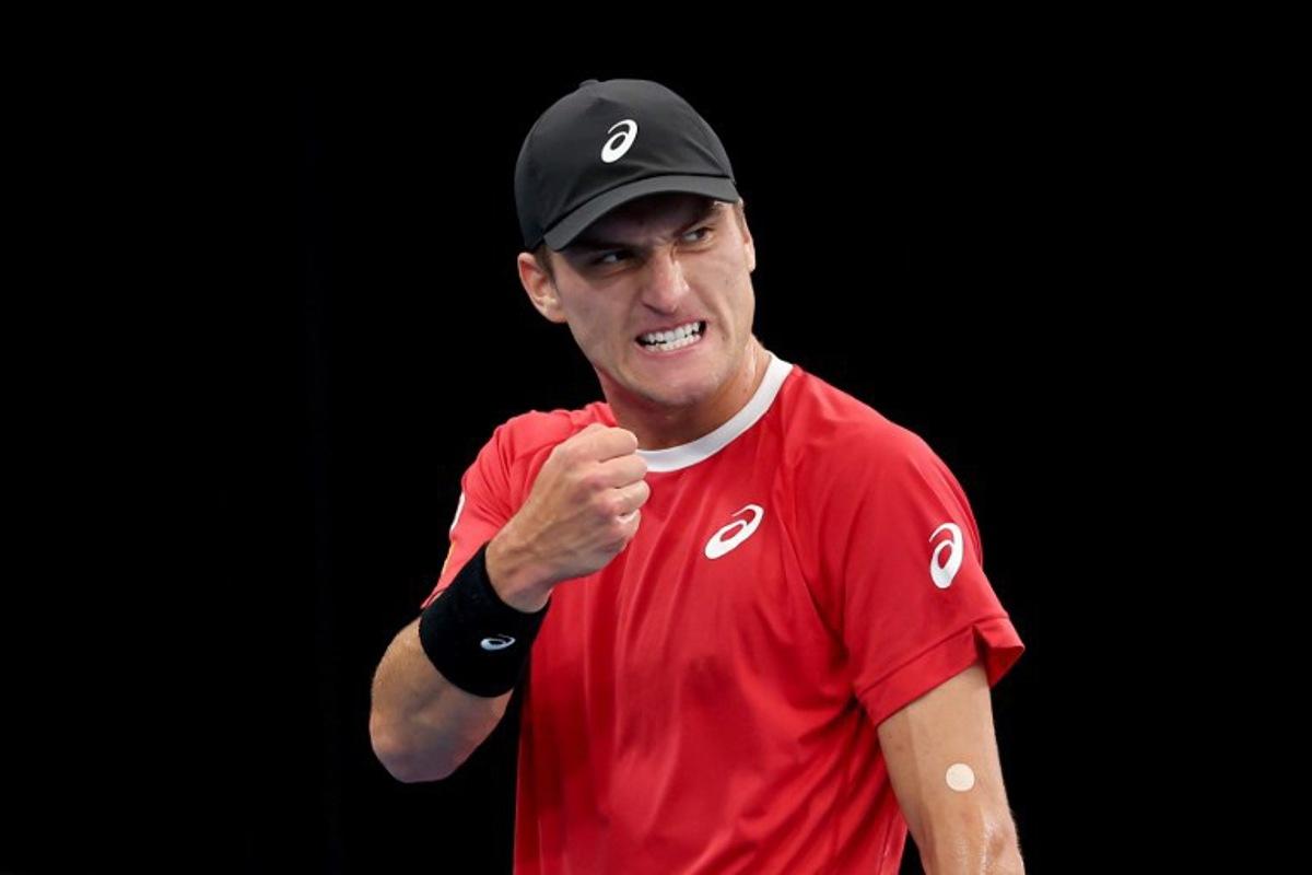 Belgium's Raphael Collignon reacts after winning a point against Australia's Alex de Minaur during their Davis Cup second-round qualifier tennis match at Ken Rosewall Arena in Sydney on September 13, 2025. DAVID GRAY / AFP