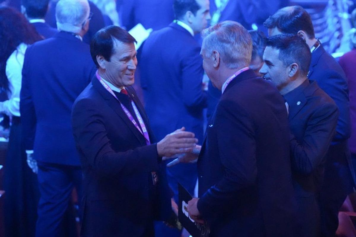 Belgium's French head coach Rudi Garcia (L) speaks with Brazil's Italian head coach Carlo Ancelotti (center R) as during the draw for the 2026 FIFA Football World Cup taking place in the US, Canada and Mexico, at the Kennedy Center, in Washington, DC, on December 5, 2025. Stephanie Scarbrough / POOL / AFP