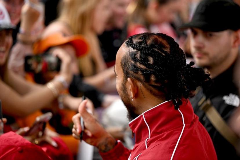 Ferrari's British driver Lewis Hamilton meets with fans as he arrives ahead of the Formula One Australian Grand Prix at the Albert Park Circuit in Melbourne on March 16, 2025. Saeed KHAN / AFP