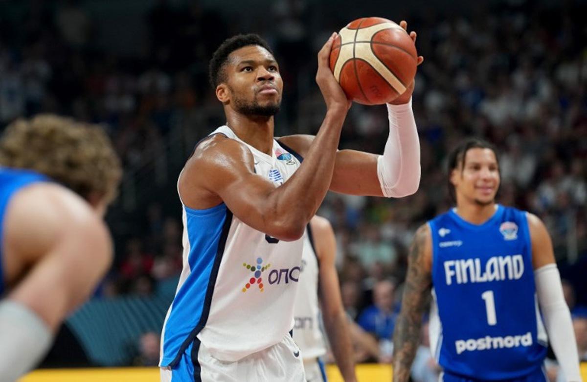 Greece's small forward #34 Giannis Antetokounmpo (C) holds the ball during the FIBA EuroBasket 2025 third place basketball match between Greece and Finland in Riga, Latvia, on September 14, 2025. Gints Ivuskans / AFP