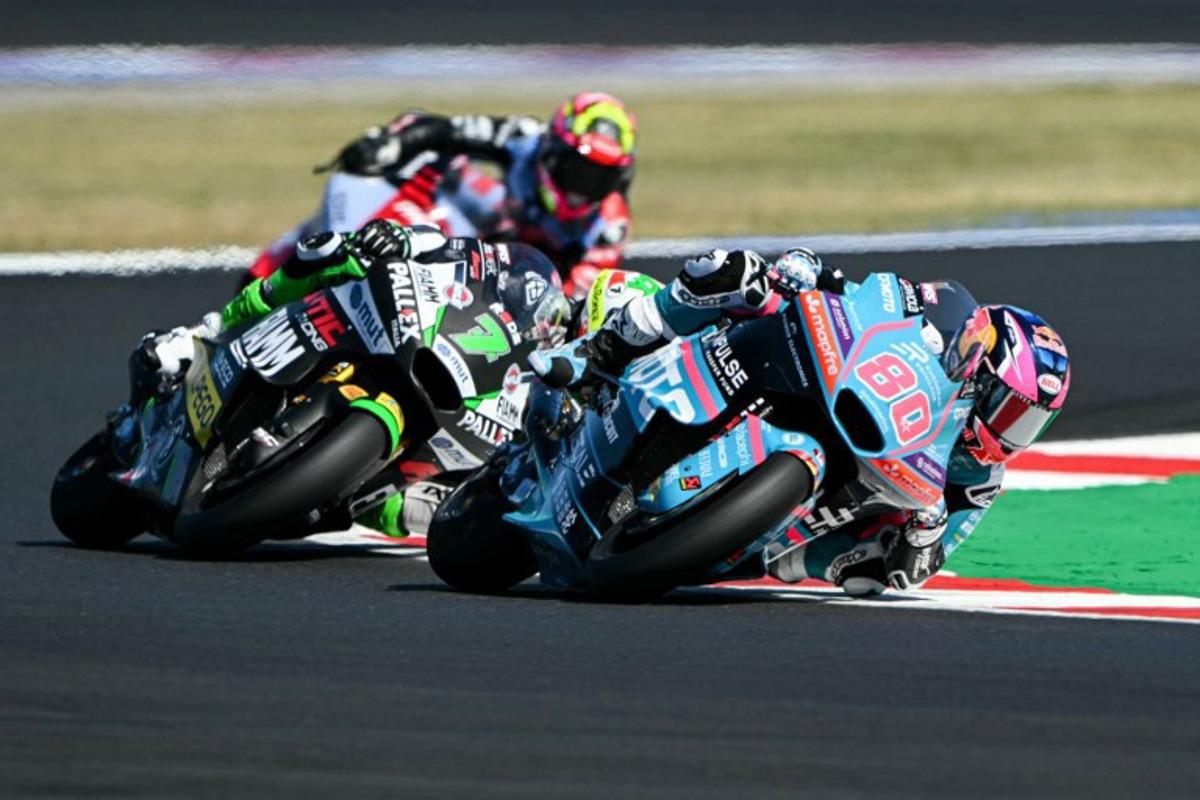 REDS Fantic Racing's Belgian rider Barry Baltus (C) and CFMOTO Aspar European Privilege Team's Colombian rider David Alonso compete during the qualifying session for the Moto2 race as part of the Misano World Circuit Marco Simoncelli, in Misano Adriatico, northern Italy on September 12, 2026. Andreas SOLARO / AFP