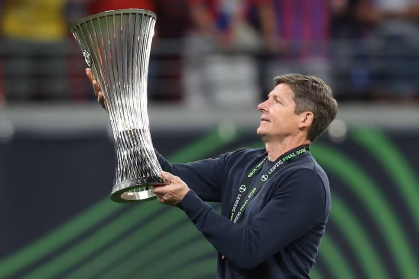 Crystal Palace's Austrian manager Oliver Glasner lifts the trophy after his team won the UEFA Conference League final football match between Crystal Palace FC and Rayo Vallecano de Madrid in Leipzig, eastern Germany, on May 27, 2026. Ronny HARTMANN / AFP