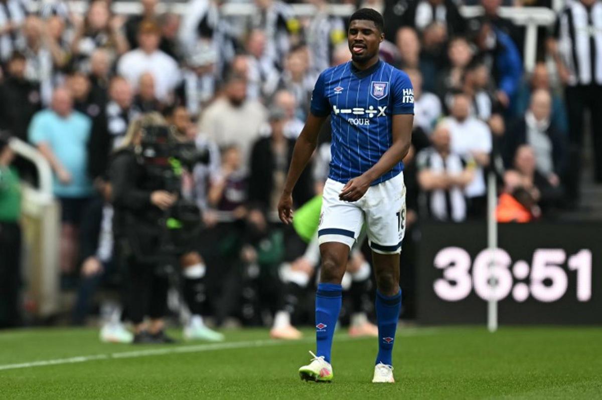Ipswich Town's English defender #18 Ben Johnson leaves the pitch after being sent off for a second yellow card offence during the English Premier League football match between Newcastle United and Ipswich Town at St James' Park in Newcastle-upon-Tyne, north east England on April 26, 2025. Paul ELLIS / AFP