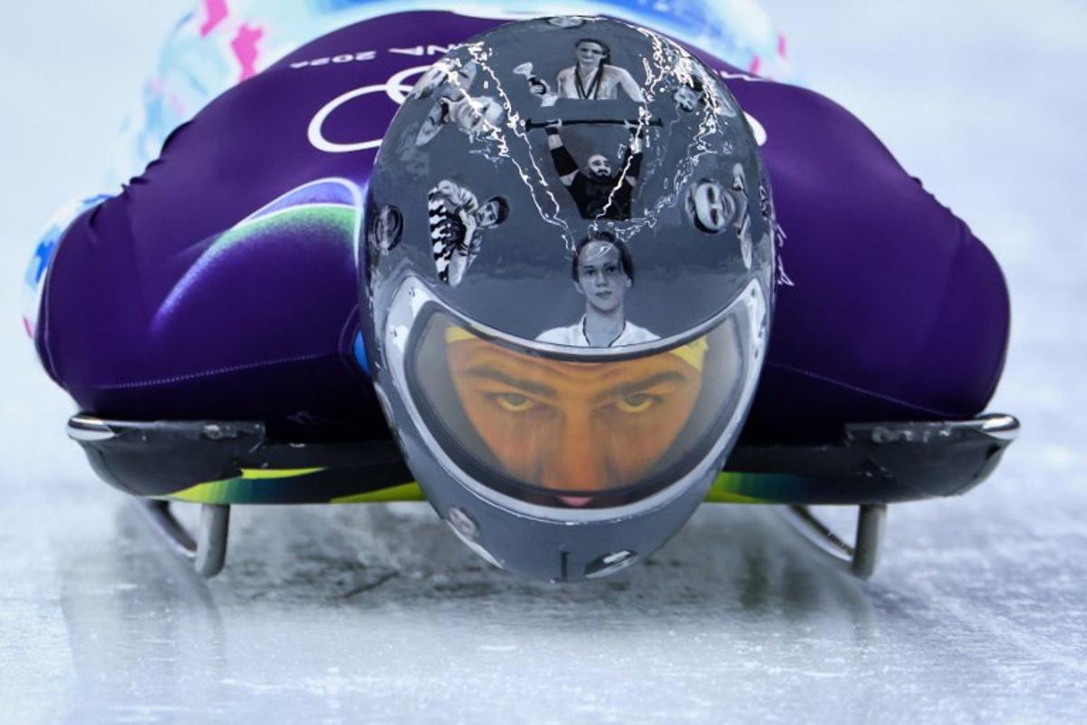 Ukraine's Vladyslav Heraskevych takes part in the skeleton men's training session at Cortina Sliding Centre during the Milano Cortina 2026 Winter Olympic Games in Cortina d'Ampezzo on February 9, 2026. FRANCK FIFE / AFP