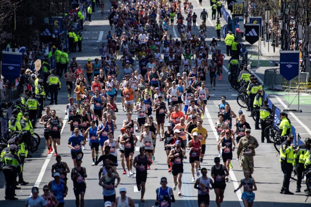 Runners make their way down Boylston Street as they compete in the 129th Boston Marathon on April 21, 2025, in Boston, Massachusetts. The marathon includes around 30,000 athletes from 129 countries running the 26.2 miles from Hopkinton to Boston, Massachusetts. The event is the world's oldest annually run marathon. Joseph Prezioso / AFP