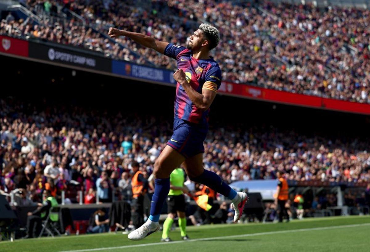 Barcelona's Uruguayan defender #04 Ronald Federico Araujo da Silva celebrates scoring his team's first goal during the Spanish league football match between FC Barcelona and Rayo Vallecano de Madrid at Camp Nou Stadium in Barcelona on March 22, 2026. Josep LAGO / AFP