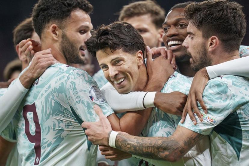 Portugal's defender #20 Joao Cancelo (C) celebrates scoring the opening goal with his teammates during the UEFA Nations League Group A4 match between Denmark and Portugal at Parken stadium in Copenhagen on October 1, 2026. Liselotte Sabroe / Ritzau Scanpix / AFP