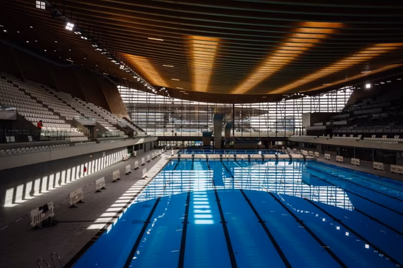 This photograph taken on March 28, 2024 shows the swimming pools and diving boards, in the Aquatics Centre built for the Paris 2024 Olympic Games to be used for artistic swimming, diving and water polo competitions in Saint Denis, near Paris. Dimitar DILKOFF / AFP