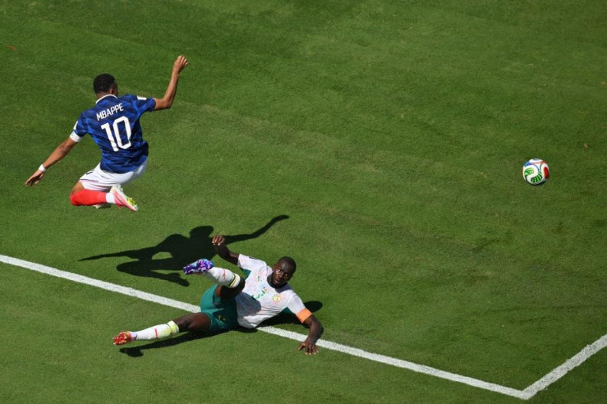 France's forward #10 Kylian Mbappe and Senegal's defender #03 Kalidou Koulibaly fight for the ball during of the 2026 World Cup Group I football match between France and Senegal at the New York/New Jersey Stadium in East Rutherford on June 16, 2026. Angela WEISS / AFP