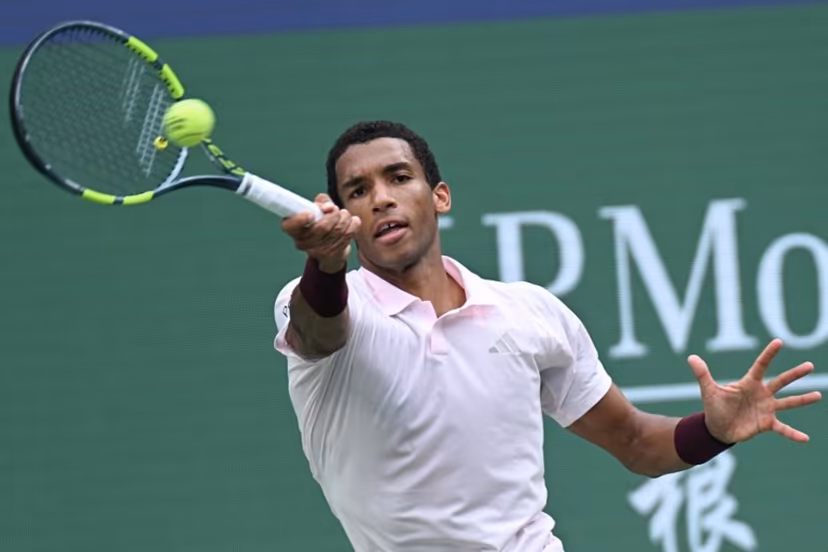 Canada's Felix Auger-Aliassime hits a return to Spain's Pablo Carreno Busta during their men's singles match at the Shanghai Masters tennis tournament in Shanghai on October 12, 2026. CN-STR / AFP