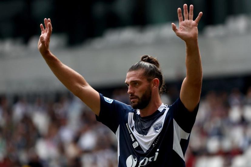 Girondins de Bordeaux's English forward Andy Carroll waves during the French Nationale 2 football match between Girondins de Bordeaux and Voltigeurs de Chateaubriant at the Matmut Atlantique Stadium in Bordeaux, south-western France, on September 21, 2024. After losing their professional status and being administratively demoted to Nationale 2, an amateur level, by the Direction Nationale du Controle de Gestion (DNCG) this summer, one of the biggest winners in French football is back on September 21, 2024. ROMAIN PERROCHEAU / AFP