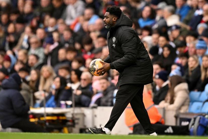 Manchester City's Ivorian assistant coach Kolo Touré holds the ball during the English FA Cup third round football match between Manchester City and Salford City at the Etihad Stadium in Manchester, north west England, on February 14, 2026. Oli SCARFF / AFP