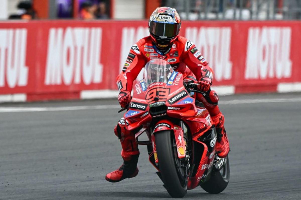 Ducati Lenovo Team's Spanish MotoGP rider Marc Marquez competes in the MotoGP class race of the MotoGP Japanese Grand Prix at the Mobility Resort Motegi in Motegi, Tochigi prefecture on September 28, 2025. Toshifumi KITAMURA / AFP