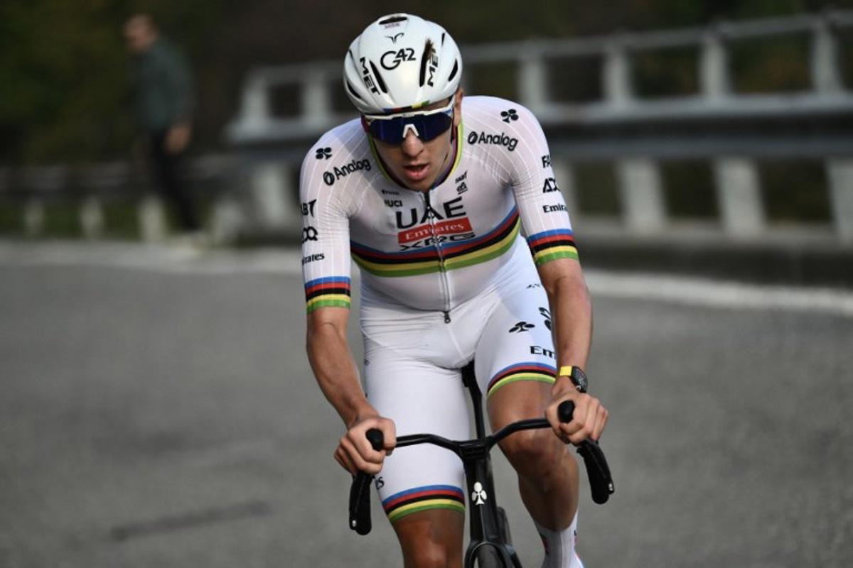 UAE Team Emirates's Slovenian rider Tadej Pogacar attacks to take the lead, in the Passo Di Ganda ascent during the 119th edition of the Giro di Lombardia (Tour of Lombardy), a 238km cycling race from Como to Bergamo on October 11, 2025. Marco BERTORELLO / AFP