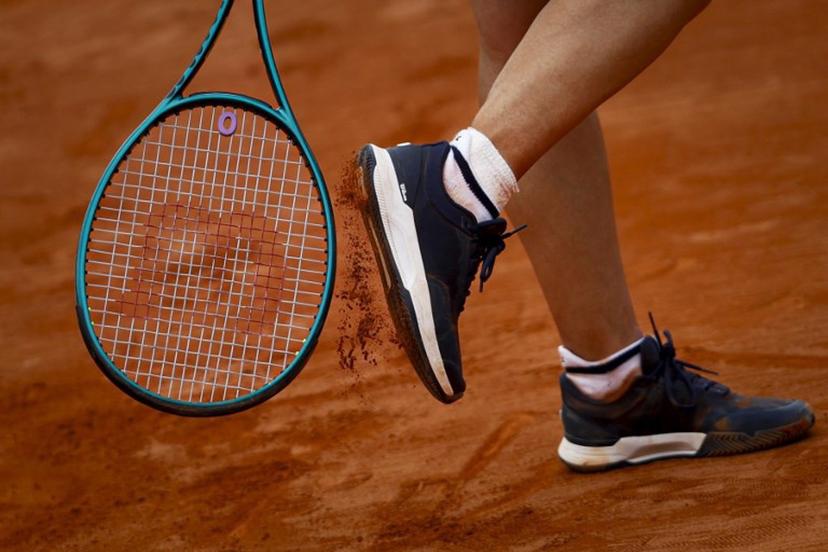 France's Leolia Jeanjean taps her shoe with her racket during her women's singles match against Romania's Elena Ruxandra Bertea at the Billie Jean King Cup play-offs between France and Romania, at Oeiras on the outskirts of Lisbon, on April 9, 2026. FILIPE AMORIM / AFP