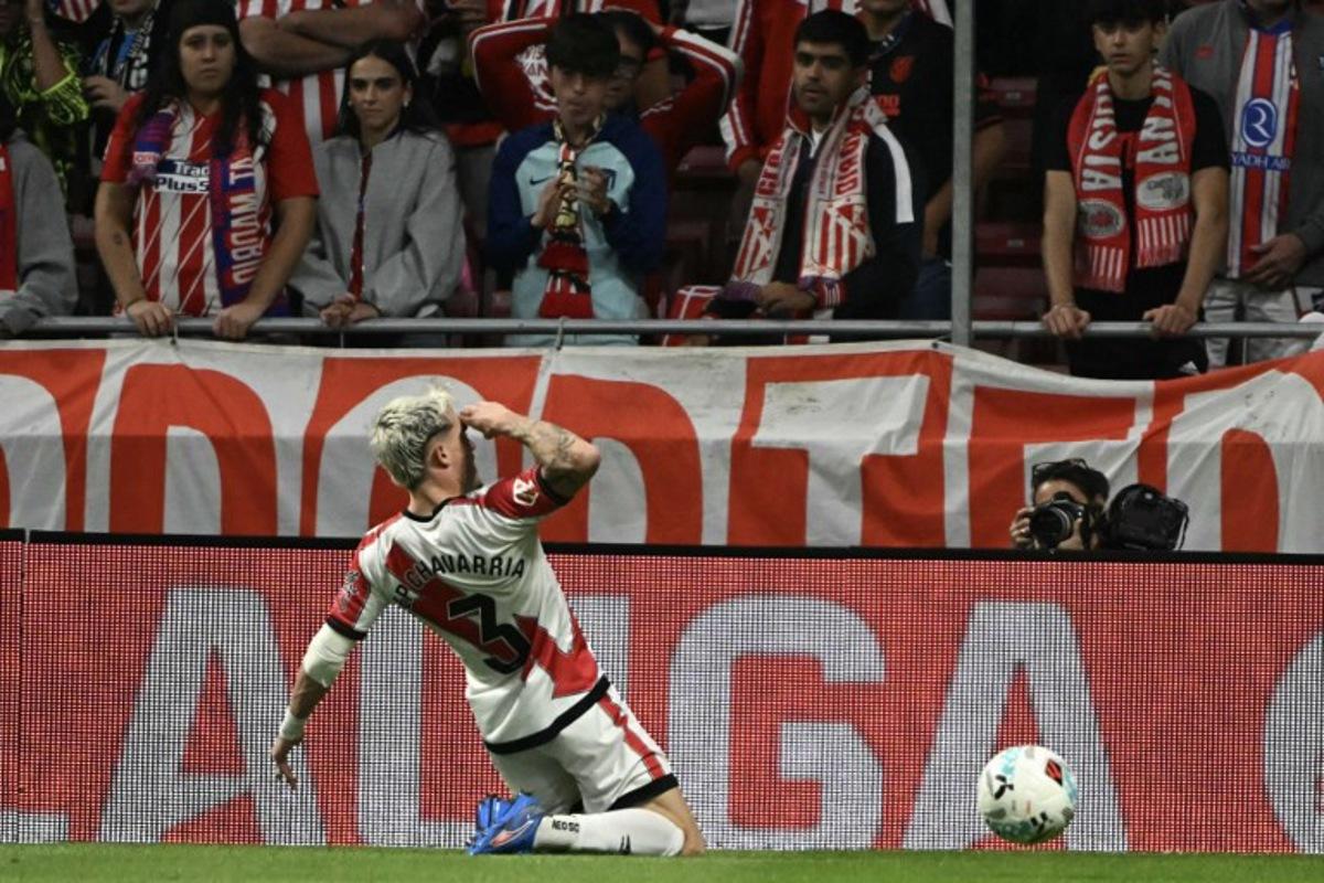 Rayo Vallecano's Spanish defender #03 Pep Chavarria celebrates scoring their first goal during the Spanish league football match between Club Atletico de Madrid and Rayo Vallecano de Madrid at the Metropolitano stadium in Madrid on September 24, 2025. Javier SORIANO / AFP