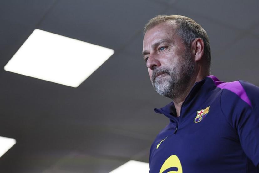 Barcelona's coach Hansi Flick leaves after giving a press conference on the eve of the UEFA Champions League league phase day 3 football match between FC Barcelona and Olympiakos at the Joan Gamper training ground in Sant Joan Despi, near Barcelona, on October 20, 2025. Josep LAGO / AFP