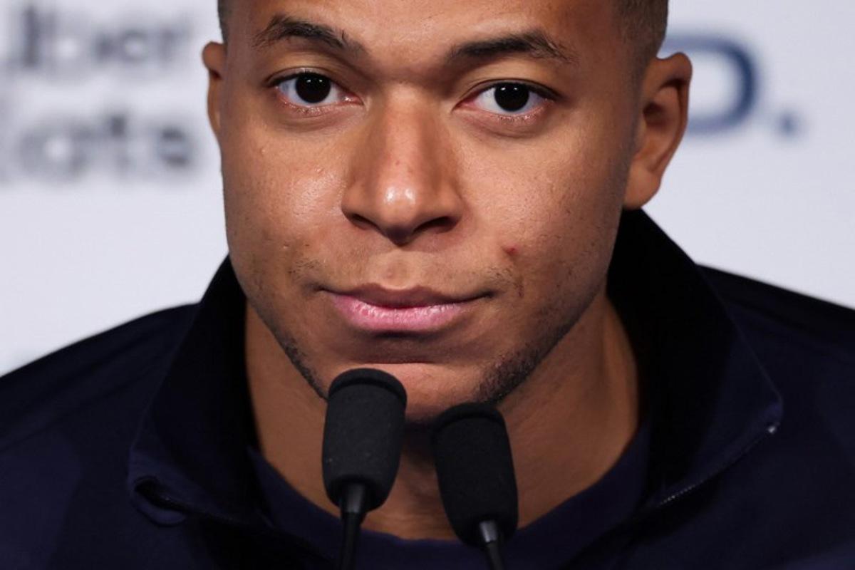(FILES) France's forward Kylian Mbappe looks on during a press conference at the Parc des Princes stadium, in Paris, on November 12, 2025 on the eve of the FIFA World Cup 2026 Group D European qualification football match against Ukraine. France's forward Kylian Mbappe and the PSG football club will appear before the Paris labour court on November 17, 2025. Franck FIFE / AFP