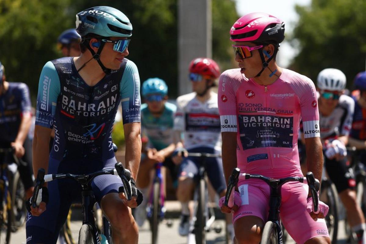 Pink jersey Bahrain - Victorious Portuguese rider Afonso Eulalio chats with teammate Bahrain - Victorious Belgian rider Alec Segaert before the 13th stage of the Giro d'Italia 2026 - Tour of Italy cycling race between Alessandria and Verbania, Italy, on May 22, 2026. Luca Bettini / AFP