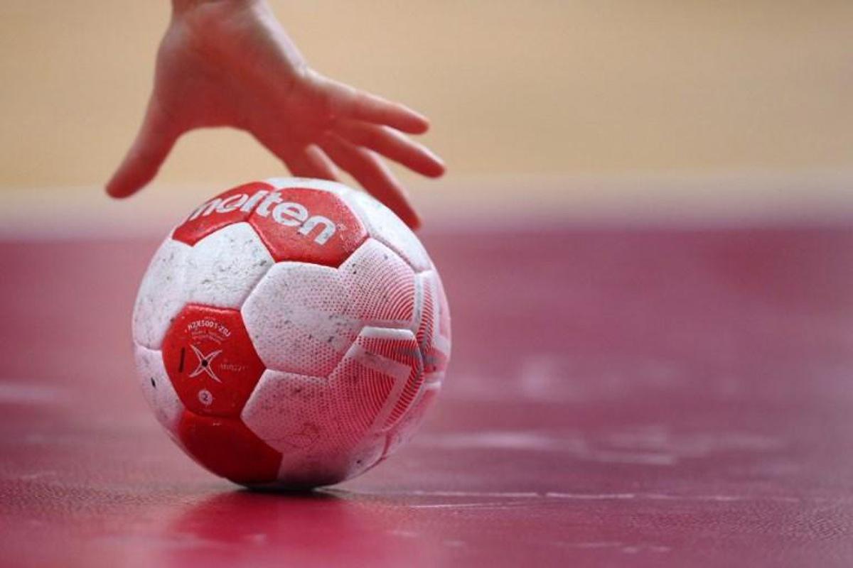 A player grabs the ball during the women's quarterfinal handball match between Sweden and South Korea of the Tokyo 2020 Olympic Games at the Yoyogi National Stadium in Tokyo on August 4, 2021. Franck FIFE / AFP