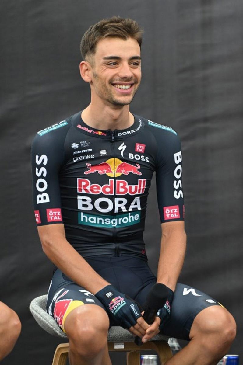 Italy's Matteo Sobrero attends the presentation of the new Red Bull-Bora-Hansgrohe cycling team in Salzburg, Austria, on June 26, 2024. Red Bull on June 26, 2024 unveiled its eight-rider cycling team to debut in this week's Tour de France, marking the energy drink maker's latest expansion of its sports empire. Earlier this year, Red Bull bought a controlling stake in the German Bora-Hansgrohe cycling team. KERSTIN JOENSSON / AFP