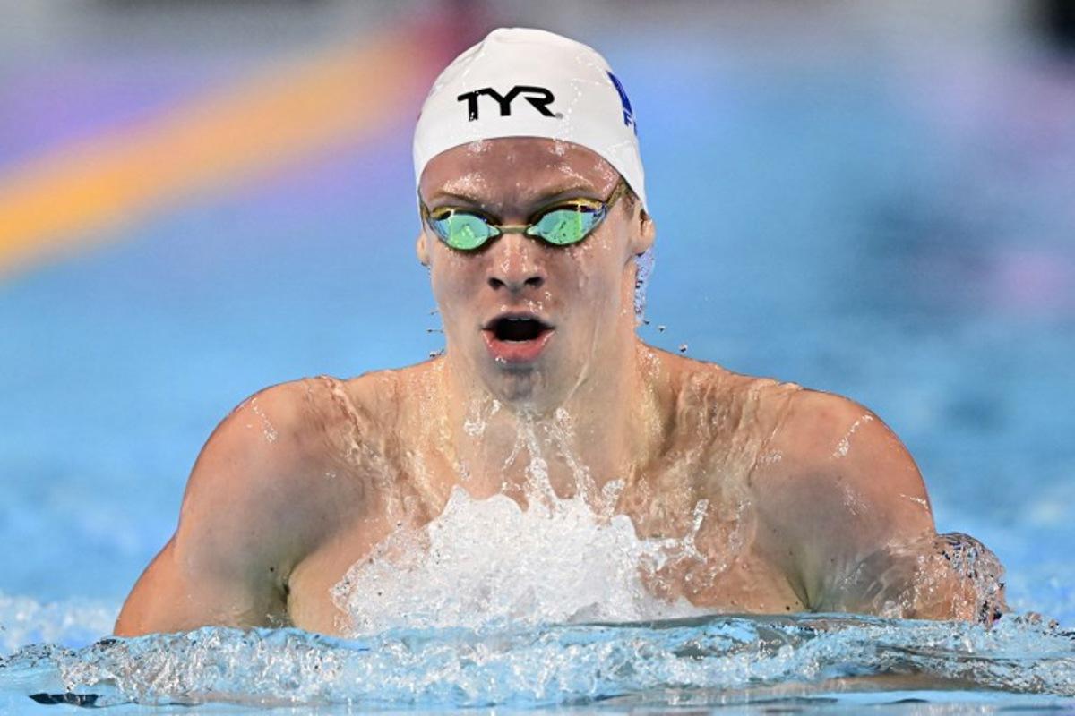 France's swimmer Leon Marchand competes in a heat of the men's 200m individual medley swimming event during the 2025 World Aquatics Championships in Singapore on July 30, 2025. MANAN VATSYAYANA / AFP
