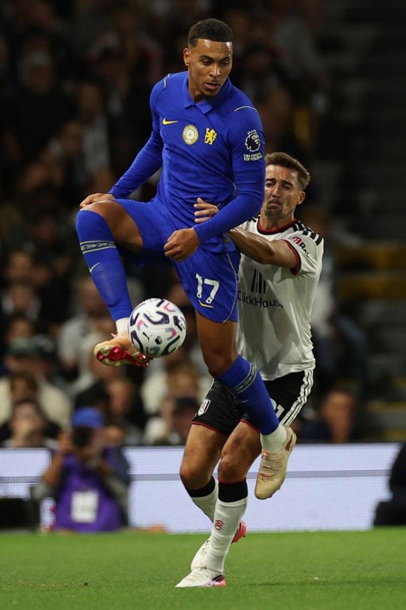 Chelsea's English midfielder #17 Morgan Rogers (L) vies with Fulham's Belgian defender #21 Timothy Castagne (R) during the English Premier League football match between Fulham and Chelsea at Craven Cottage in London on August 24, 2026. Adrian Dennis / AFP