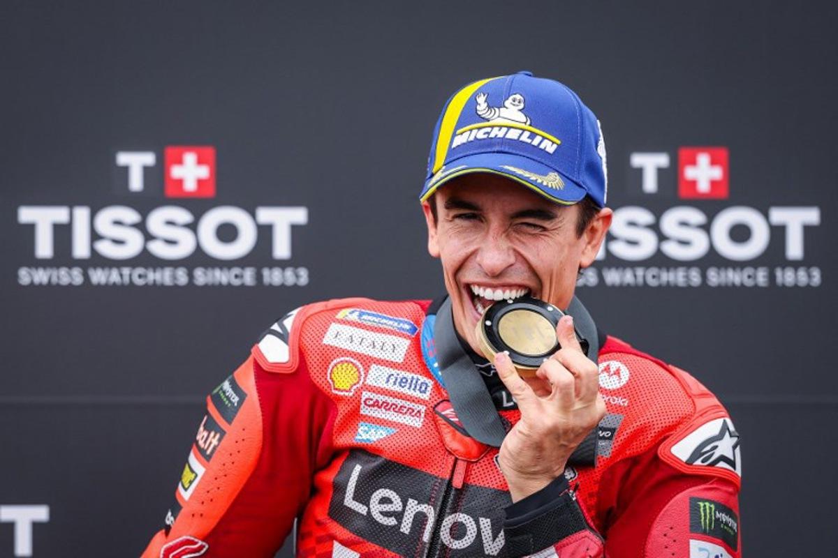 Ducati Lenovo Team's Spanish MotoGP rider Marc Marquez celebrates after winning the sprint race of the MotoGP German motorcycle Grand Prix at the Sachsenring racing circuit, in Hohenstein-Ernstthal near Chemnitz, eastern Germany on July 12, 2025. Ronny Hartmann / AFP