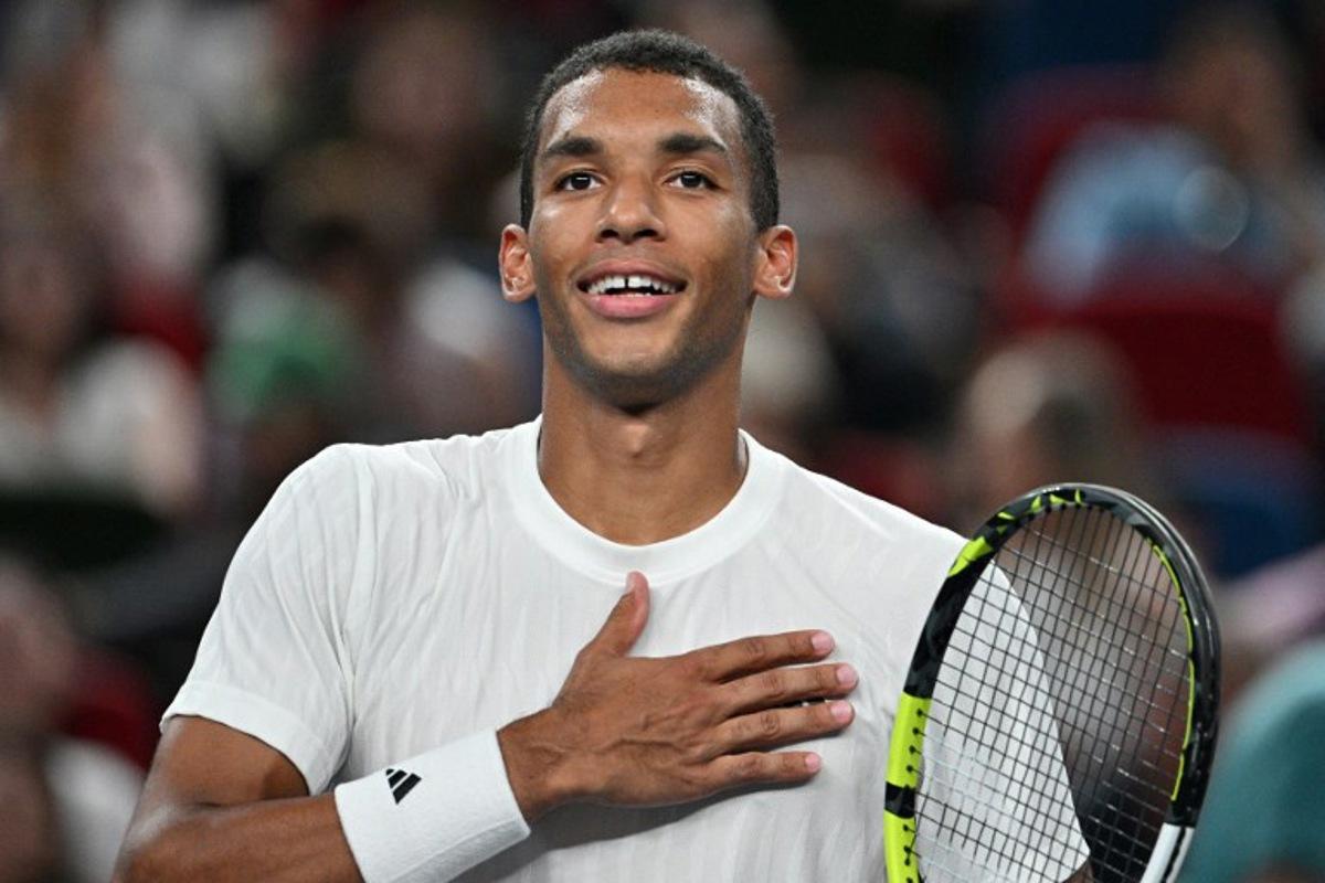 Canada's Felix Auger-Aliassime celebrates after winning against Italy's Lorenzo Musetti during their men's singles match at the Shanghai Masters tennis tournament in Shanghai on October 8, 2025. Hector RETAMAL / AFP