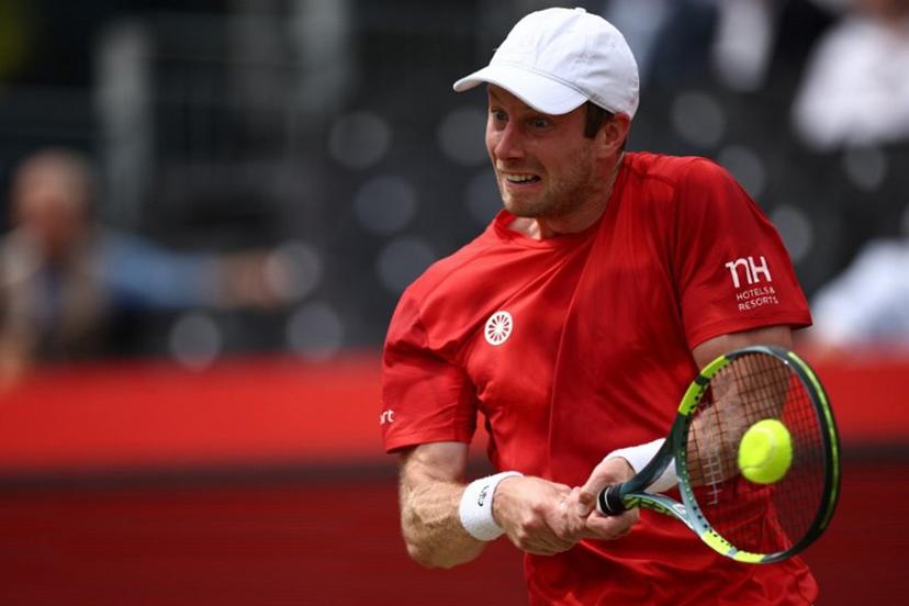 Netherlands' Botic van de Zandschulp returns against US player Tommy Paul during their men's singles round of 16 tennis match on day three of the ATP HSBC Championships at Queen's Club in west London on June 18, 2026. Henry Nicholls / AFP