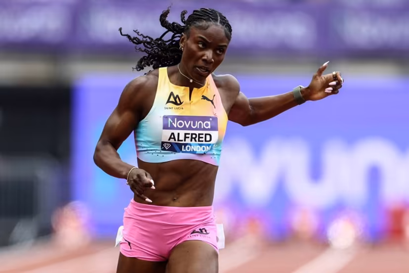 Saint Lucia's Julien Alfred crosses the finish line to win the women's 200m event during the IAAF Diamond League athletics competition at the London stadium in London on July 18, 2026. Henry NICHOLLS / AFP