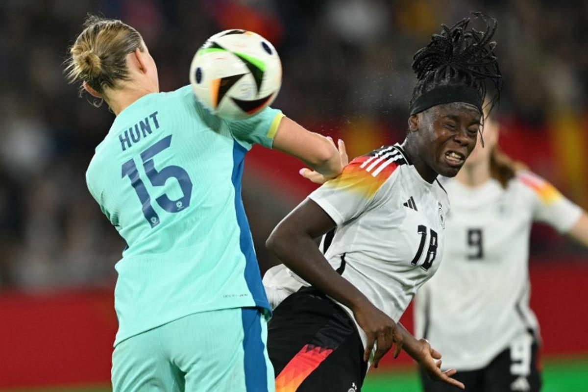 Australia's defender Clare Hunt (L) and Germany's forward Nicole Anyomi vie for the ball during the women's friendly football match Germany vs Australia in Duisburg, western Germany on October 28, 2024.  INA FASSBENDER / AFP