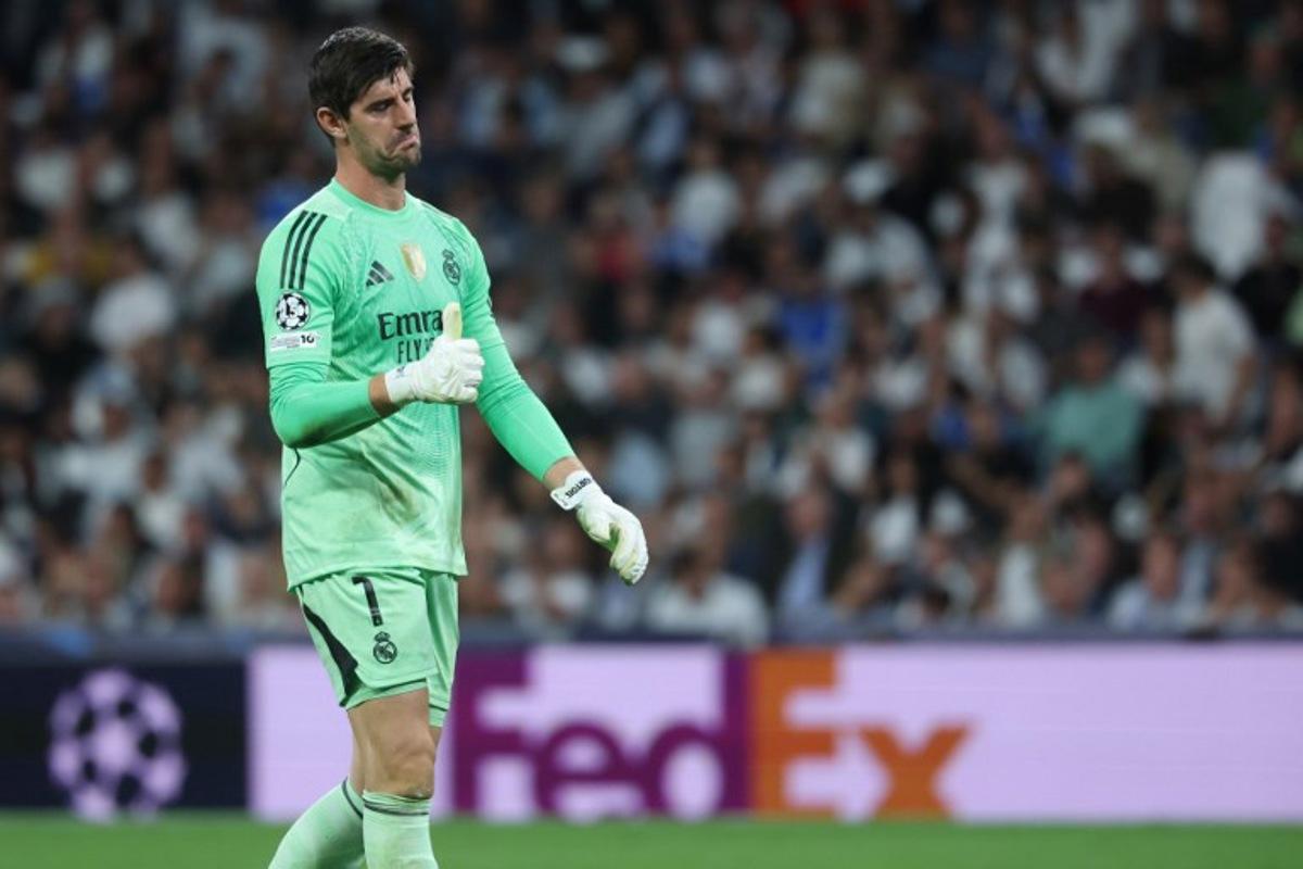 Real Madrid's Belgian goalkeeper #01 Thibaut Courtois gives a thumbs-up during the UEFA Champions League league phase day 3 football match between Real Madrid CF and Juventus at Santiago Bernabeu Stadium in Madrid on October 22, 2025. Pierre-Philippe MARCOU / AFP