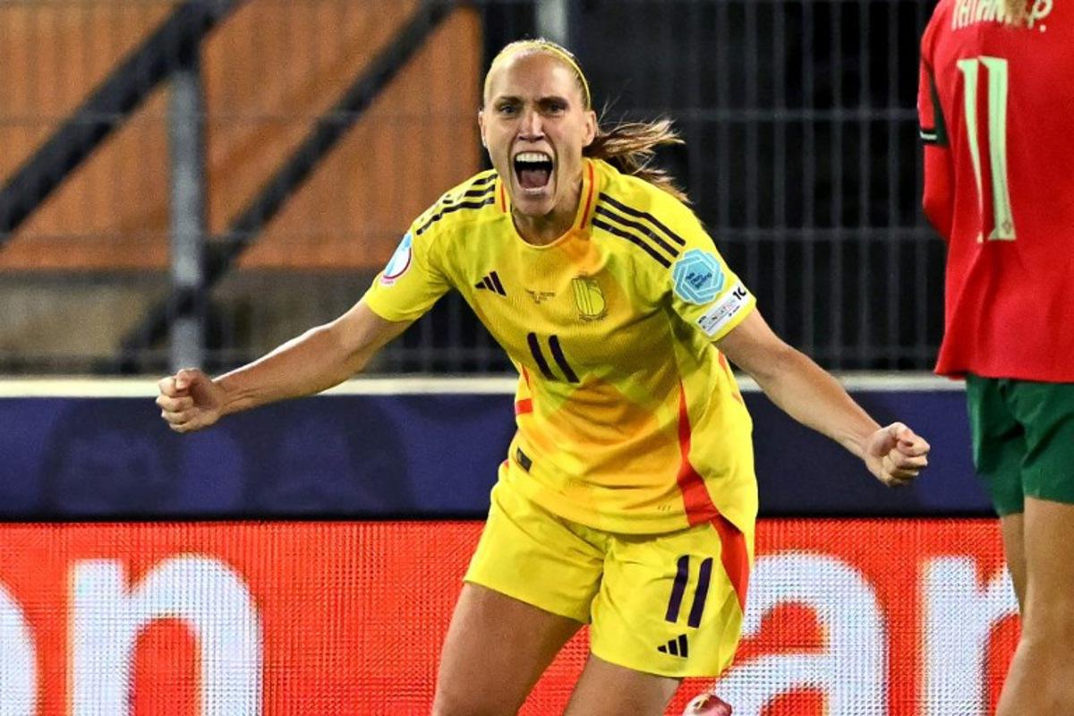 Belgium's defender #11 Janice Cayman celebrates after scoring the team's second goal during the UEFA Women's Euro 2025 Group B football match between Portugal and Belgium at the Stade de Tourbillon in Sion, on July 11, 2025. Fabrice COFFRINI / AFP