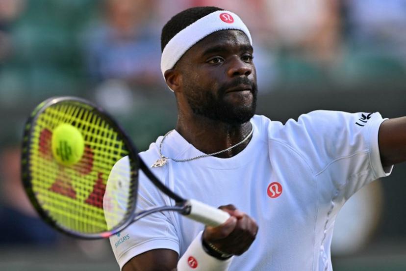 US player Frances Tiafoe returns to Kazakhstan's Alexander Bublik during their men's singles third round tennis match on the sixth day of the 2026 Wimbledon Championships at The All England Lawn Tennis and Croquet Club in Wimbledon, southwest London, on July 4, 2026. Glyn KIRK / AFP