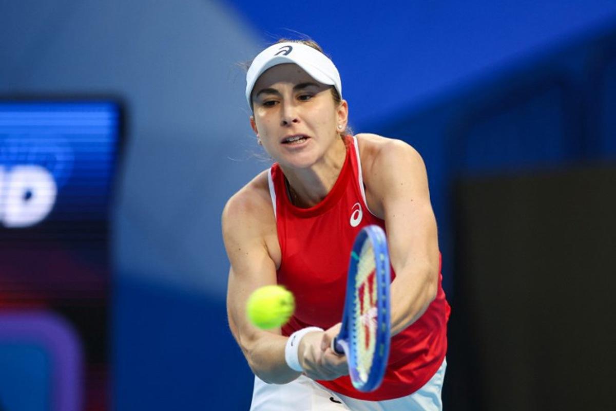 Switzerland's Belinda Bencic hits a return to Argentina's Solana Sierra during their women's single match at the United Cup tennis tournament in Perth on January 7, 2026. Antony DICKSON / AFP