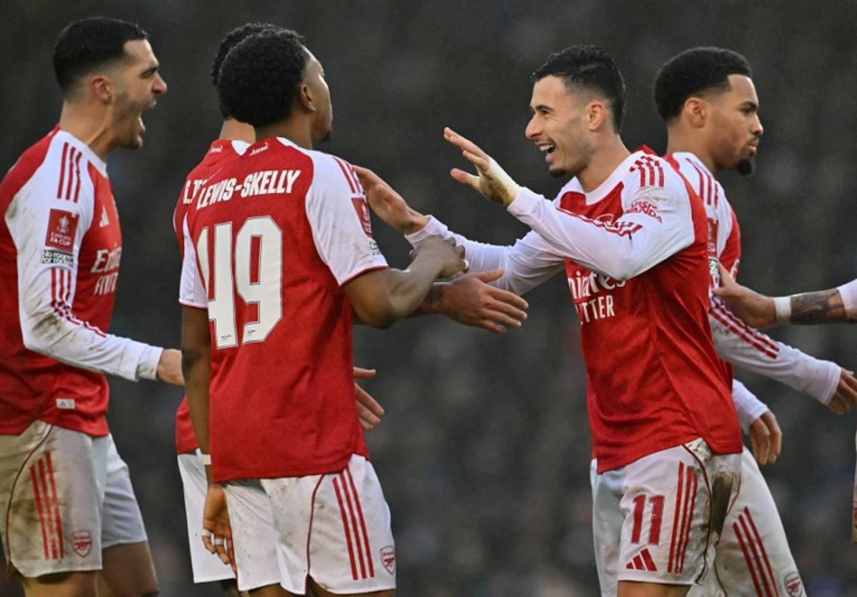 Arsenal's Brazilian midfielder #11 Gabriel Martinelli (2R) celebrates scoring the team's third goal during the English FA Cup third round football match between Portsmouth and Arsenal at Fratton Park in Portsmouth, southern England on January 11, 2026. Glyn KIRK / AFP