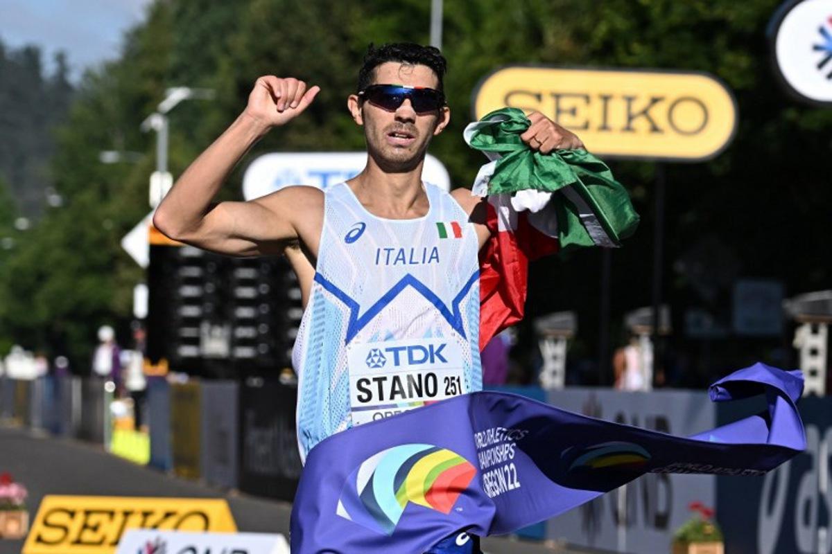 Italy's Massimo Stano crosses the finish line to win the men's 35km race walk final during the World Athletics Championships in Eugene, Oregon on July 24, 2022. Jim WATSON / AFP