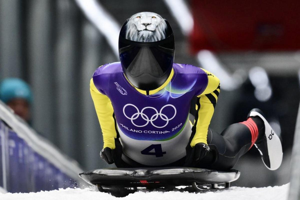 Belgium's Kim Meylemans arrives to the finish area in the skeleton women's heat 3 at Cortina Sliding Centre during the Milano Cortina 2026 Winter Olympic Games in Cortina d'Ampezzo on February 14, 2026. Stefano RELLANDINI / AFP