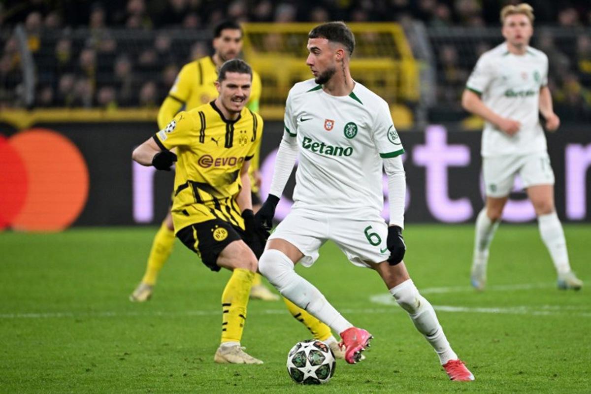 Sporting's Belgian defender #06 Zeno Debast and Dortmund's Austrian midfielder #20 Marcel Sabitzer vie for the ball during the UEFA Champions League second-leg knockout round play-off football match BVB Borussia Dortmund vs Sporting CP at the Signal Iduna stadium in Dortmund, western Germany, on February 19, 2025. UWE KRAFT / AFP