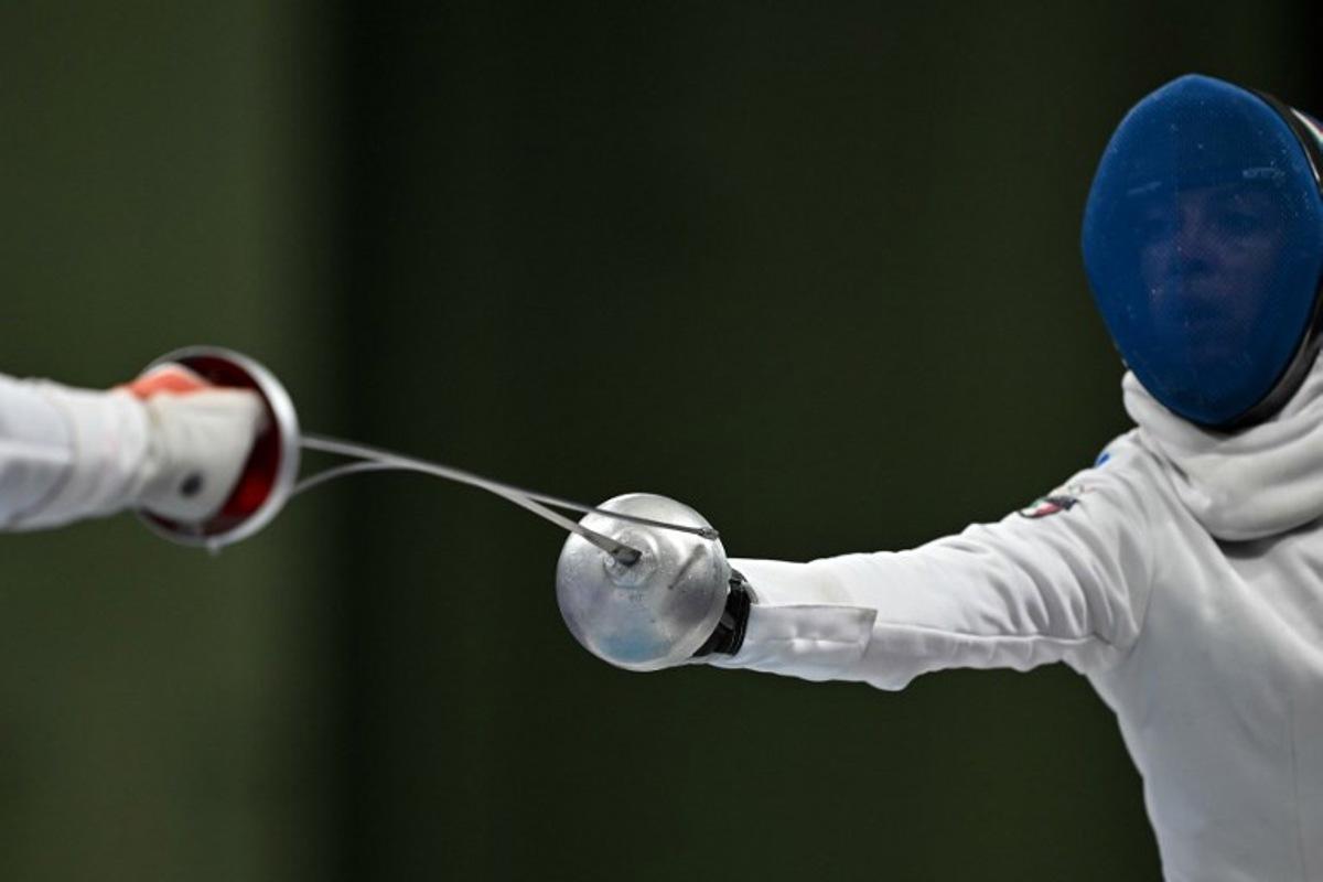 China's Tang Junyao and Italy's Alberta Santuccio compete in the women's epee team semi-final bout during the Paris 2024 Olympic Games at the Grand Palais in Paris, on July 30, 2024. Fabrice COFFRINI / AFP