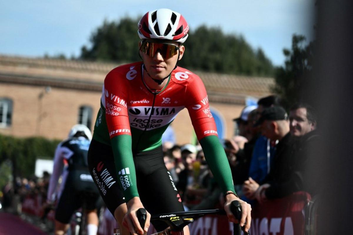 Team Visma-Lease a Bike's Hungarian rider Attila Valter prepares before the 19th one-day classic 'Strade Bianche' (White Roads) cycling race between Siena and Siena, Tuscany, on March 8, 2025. Marco BERTORELLO / AFP
