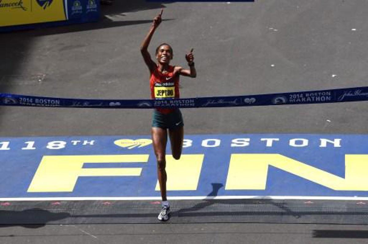 Rita Jeptoo of Kenya crosses the finish line to win the Women's Elite division of the 118th Boston Marathon in Boston, Massachusetts April 21, 2014. AFP PHOTO / Timothy A. CLARY
