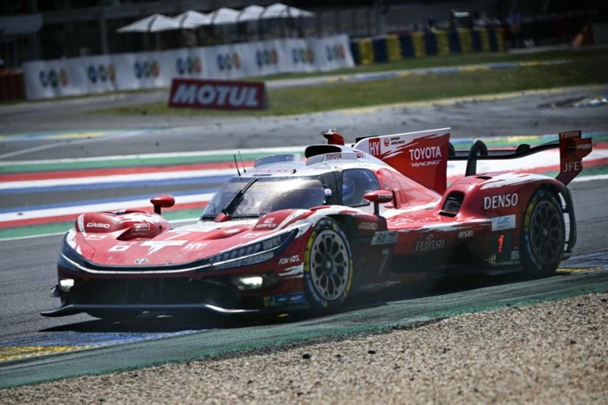 The Toyota Racing's car of British driver Mike Conway, Japanese driver Kamui Kobayashi and Dutch driver Nyck de Vriestakes a corner during the 94th edition of the 24 Hours of Le Mans at the Le Mans circuit, north-western France, on June 14, 2026. Lou BENOIST / AFP