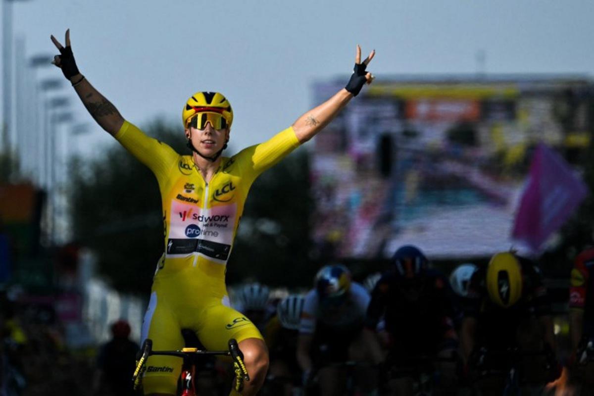 Team SD Worx-Protime's Dutch rider Lorena Wiebes wearing the overall leader's yellow jersey celebrates as she crosses the finish line to win the second (out of 9) stage of the fifth edition of the Women's Tour de France cycling race, 147.9 km from Aigle to Geneva, in Geneva on August 2, 2026. NICOLAS TUCAT / AFP