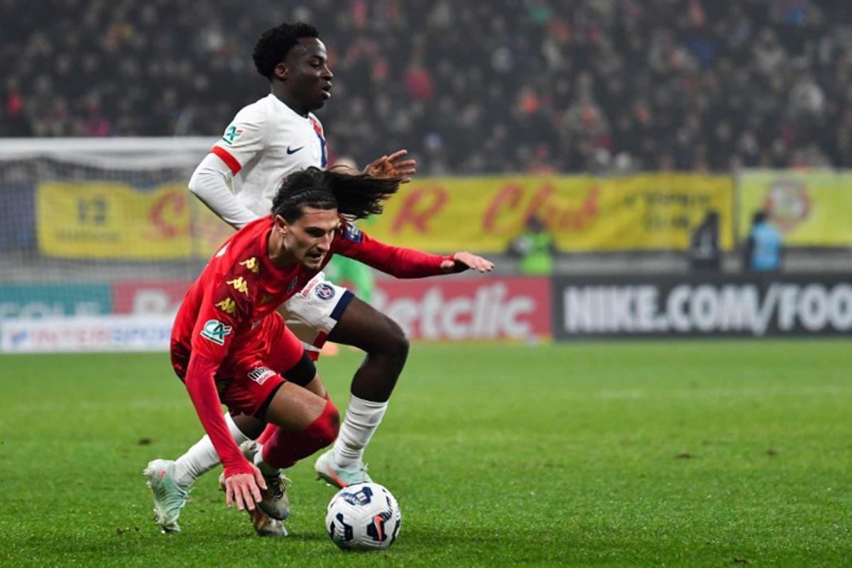 Paris Saint-Germain's French defender #02 Yoram Zague (up) fights for the ball with Le Mans' Belgian defender #11 Vincent Burlet during the French Cup (Coupe de France) round of 16 football match between Le Mans FC and Paris Saint-Germain (PSG) at the Marie-Marvingt Stadium in Le Mans, western France, on February 4, 2025. JEAN-FRANCOIS MONIER / AFP