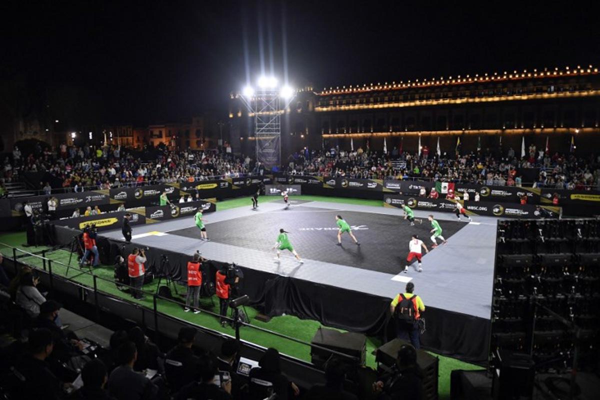 Lithuania and Mexico compete during their Baseball5 World Cup 2022 match in Zocalo square in Mexico City on November 7, 2022. CLAUDIO CRUZ / AFP